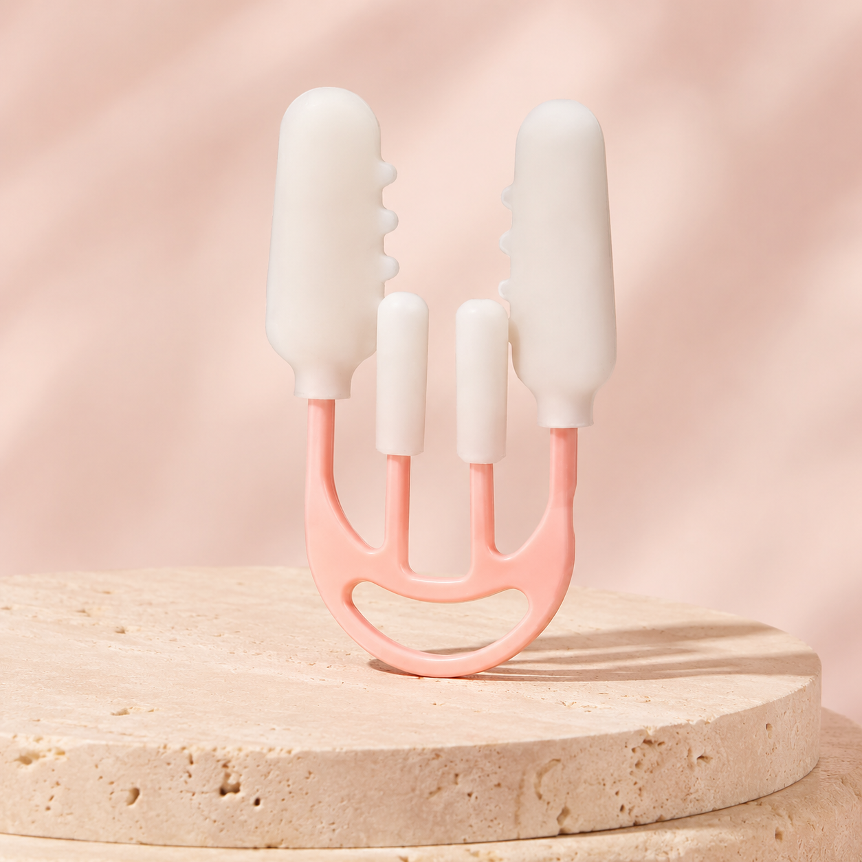 Representational editorial studio image of the Enova Nose Contour Clip on a warm stone surface
