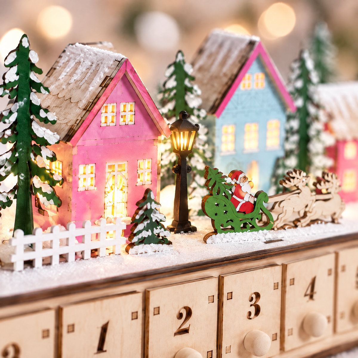 Child opening drawer 12 of the Hollyvale advent village