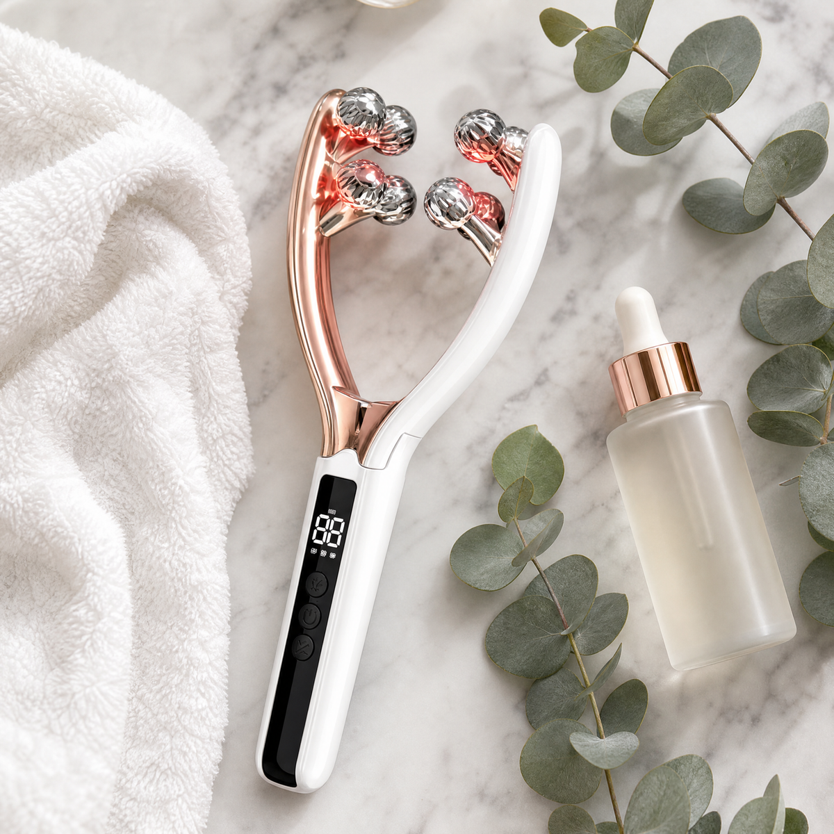 LumaSculpt massager with skincare on marble