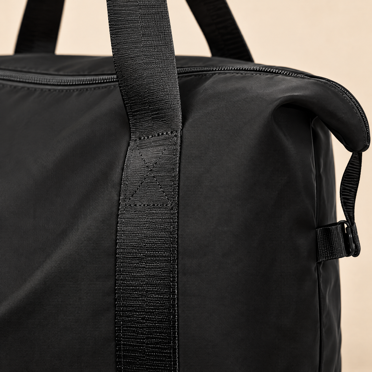 Close-up of the Nomadly duffel handles and fabric
