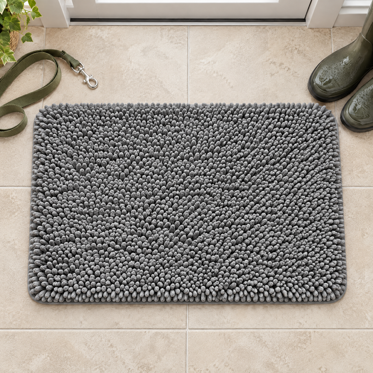 PawDry mat laid flat by the door with a leash