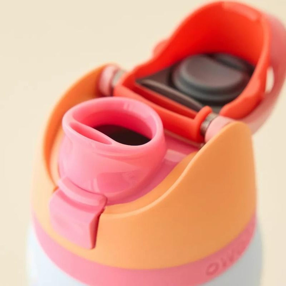 Close-up of the SipSwitch flip cap, spout and carry loop