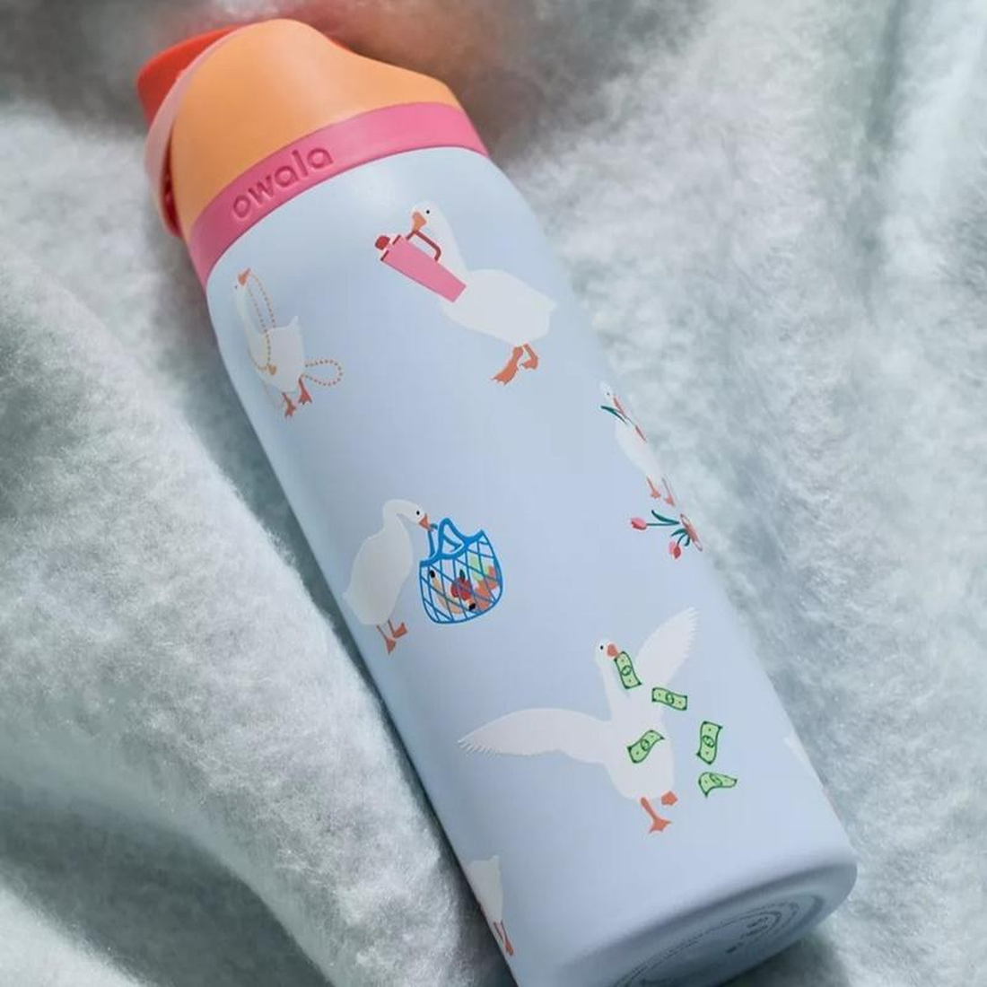SipSwitch goose print bottle on a blanket