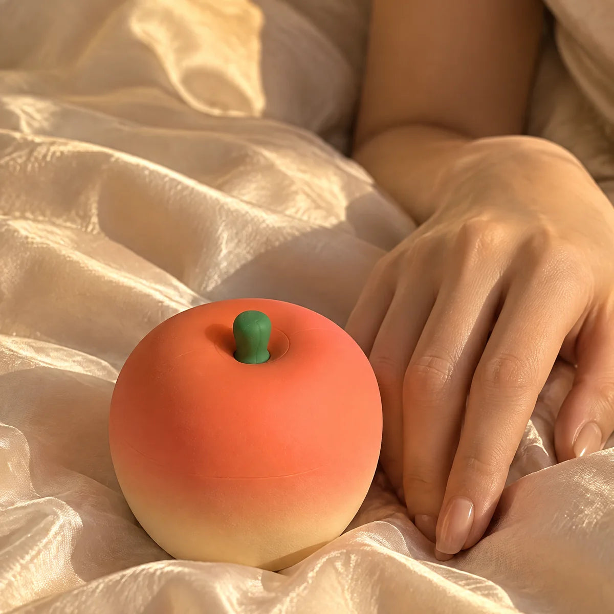 Hand resting on silk sheets